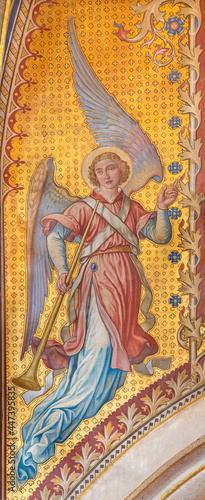 VIENNA, AUSTIRA - JUNI 24, 2021: The fresco of angel with the tompeth in the Votivkirche church by brothers Carl and Franz Jobst (sc. half of 19. cent.).