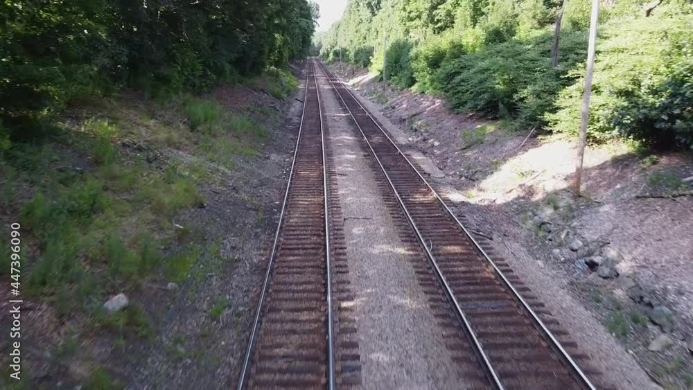 Zipping over empty train tracks in the woods in Norwood, Massachusetts. Zipping over empty train tracks in the woods in Norwood, Massachusetts.