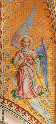 VIENNA, AUSTIRA - JUNI 24, 2021: The fresco of angel with the tompeth in the Votivkirche church by brothers Carl and Franz Jobst (sc. half of 19. cent.).