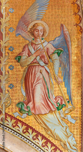 VIENNA, AUSTIRA - JUNI 24, 2021: The fresco of angel with the tompeth in the Votivkirche church by brothers Carl and Franz Jobst (sc. half of 19. cent.).