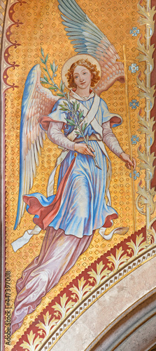 VIENNA, AUSTIRA - JUNI 24, 2021: The fresco of angel with the flower in the Votivkirche church by brothers Carl and Franz Jobst (sc. half of 19. cent.). © Renáta Sedmáková