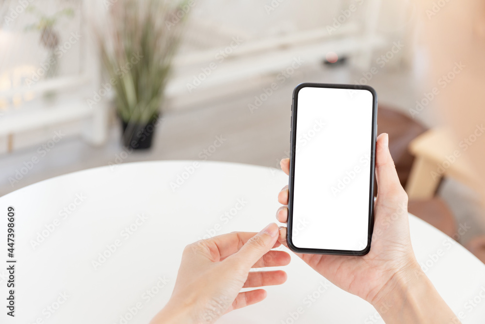 cell phone blank white screen mockup.woman hand holding texting using mobile on desk at office.background empty space for advertise.work people contact marketing business,technology cell phone blank white screen mockup.woman hand holding texting using mobile on desk at office.background empty space for advertise.work people contact marketing business,technology