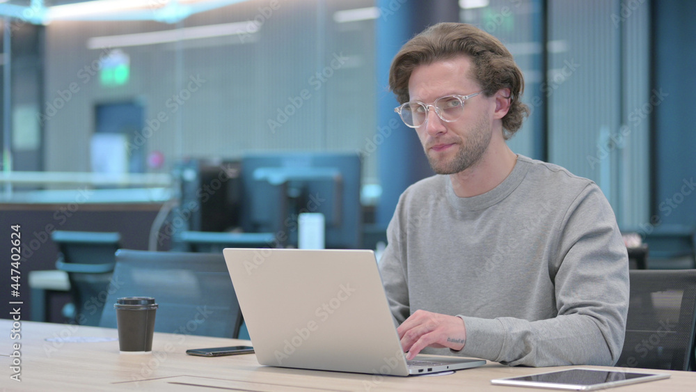 No Gesture by Head Shake by Young Man at Work No Gesture by Head Shake by Young Man at Work