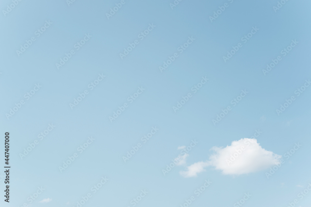 White cloud against blue clear sky, heavenly minimalistic landscape, rule of thirds. Copy space, place for your text White cloud against blue clear sky, heavenly minimalistic landscape, rule of thirds. Copy space, place for your text
