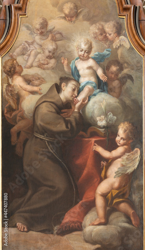 VIENNA, AUSTIRA - JULI 5, 2021: The detail of painting of St. Anthny vision of Madonna in the church Kapuzinerkirche by capuchin Norbert Baumgartner from  18. cent.. photo