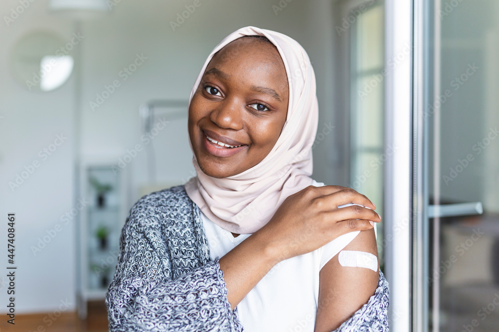 Adhesive bandage on arm after injection vaccine or medicine,ADHESIVE BANDAGES PLASTER - Medical Equipment,Soft focus Adhesive bandage on a muslim african female brachium after covid-19 vaccination Adhesive bandage on arm after injection vaccine or medicine,ADHESIVE BANDAGES PLASTER - Medical Equipment,Soft focus Adhesive bandage on a muslim african female brachium after covid-19 vaccination
