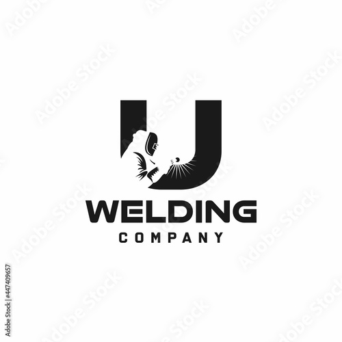 Letter U welding logo, welder silhouette working with weld helmet in simple and modern design style art