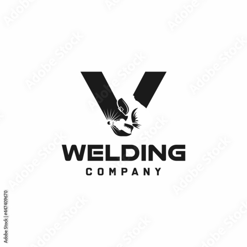Letter V welding logo, welder silhouette working with weld helmet in simple and modern design style art