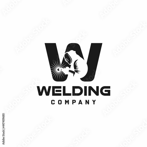 Letter W welding logo, welder silhouette working with weld helmet in simple and modern design style art