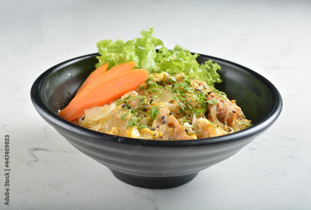 japanese oyakodon chicken rice bowl with salad in black bowl in white marble healthy poke bowl menu
