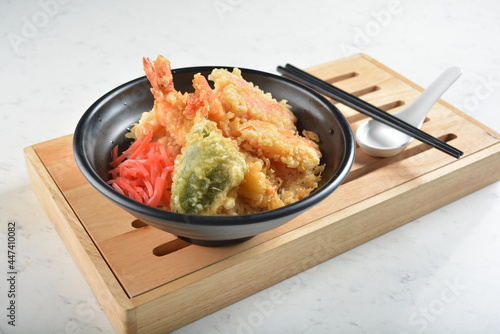 japanese deep fried tempura prawn and vegetables rice bowl in black bowl in white marble healthy poke bowl menu