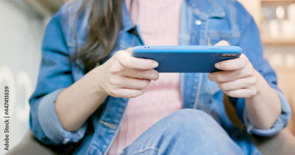 woman play games on smartphone woman play games on smartphone