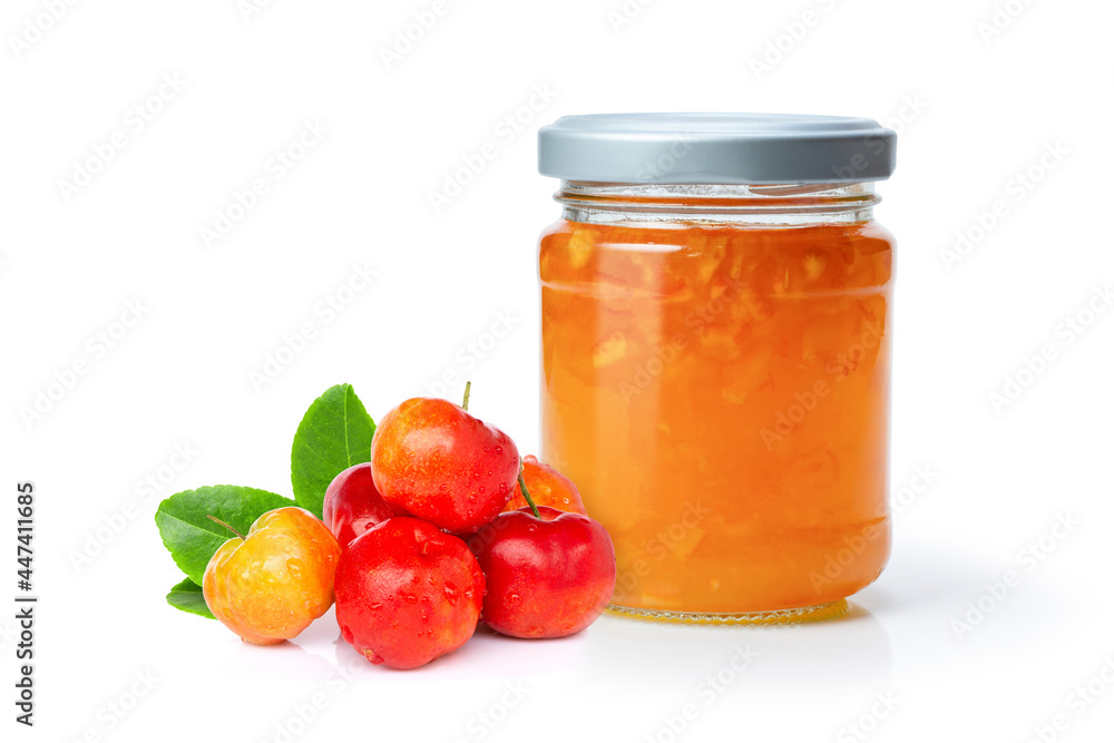 Glass jar of acerola jam and fresh acerola cherry berry fruit Glass jar of acerola jam and fresh acerola cherry berry fruit