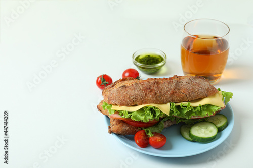 Concept of tasty eating with ciabatta sandwich on white background