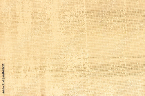 An uneven, ragged grid with small cells. Abstract rough texture with spots and stripes.