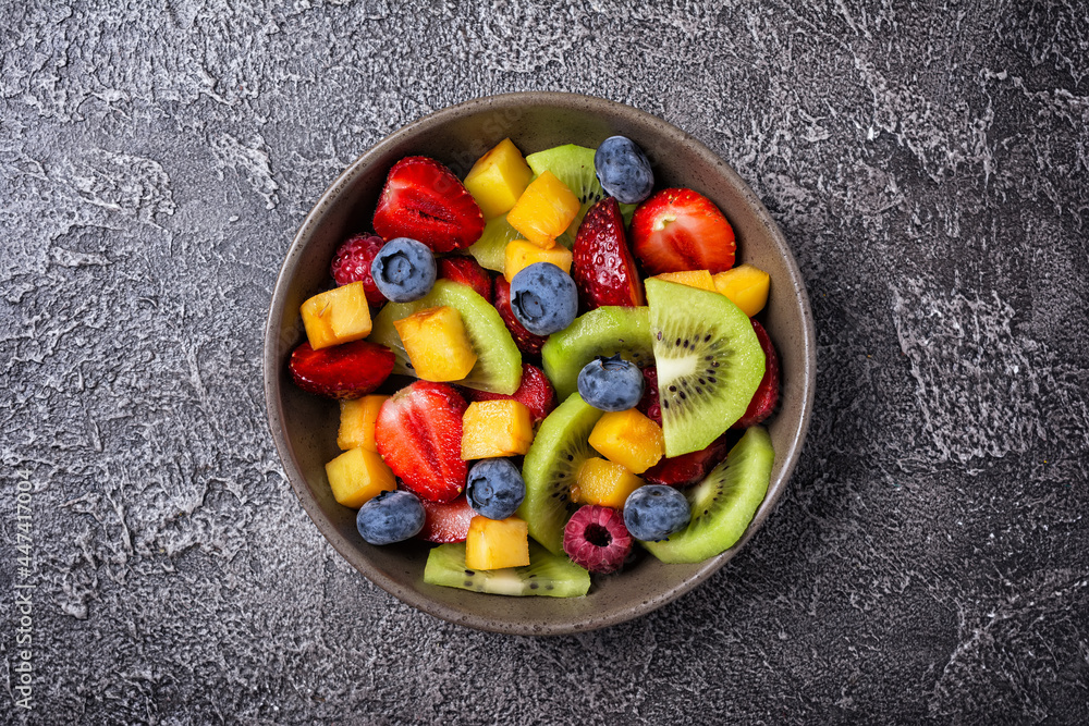 Bowl of healthy salad with fresh fruits and berries Bowl of healthy salad with fresh fruits and berries