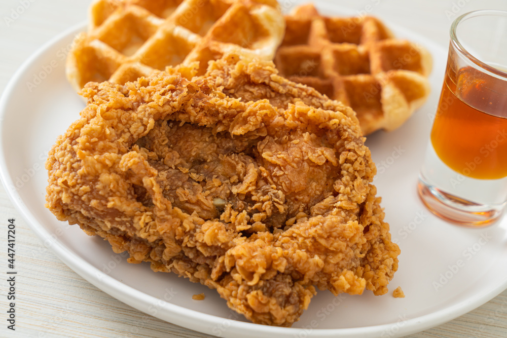 fried chicken waffle with honey or maple syrup fried chicken waffle with honey or maple syrup
