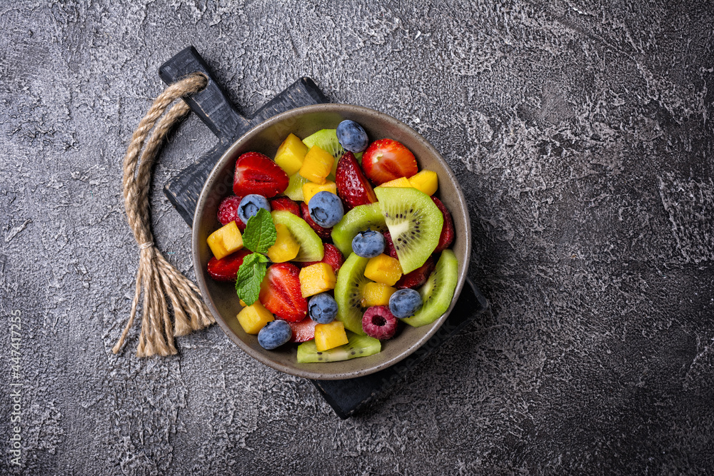Bowl of healthy salad with fresh fruits and berries Bowl of healthy salad with fresh fruits and berries