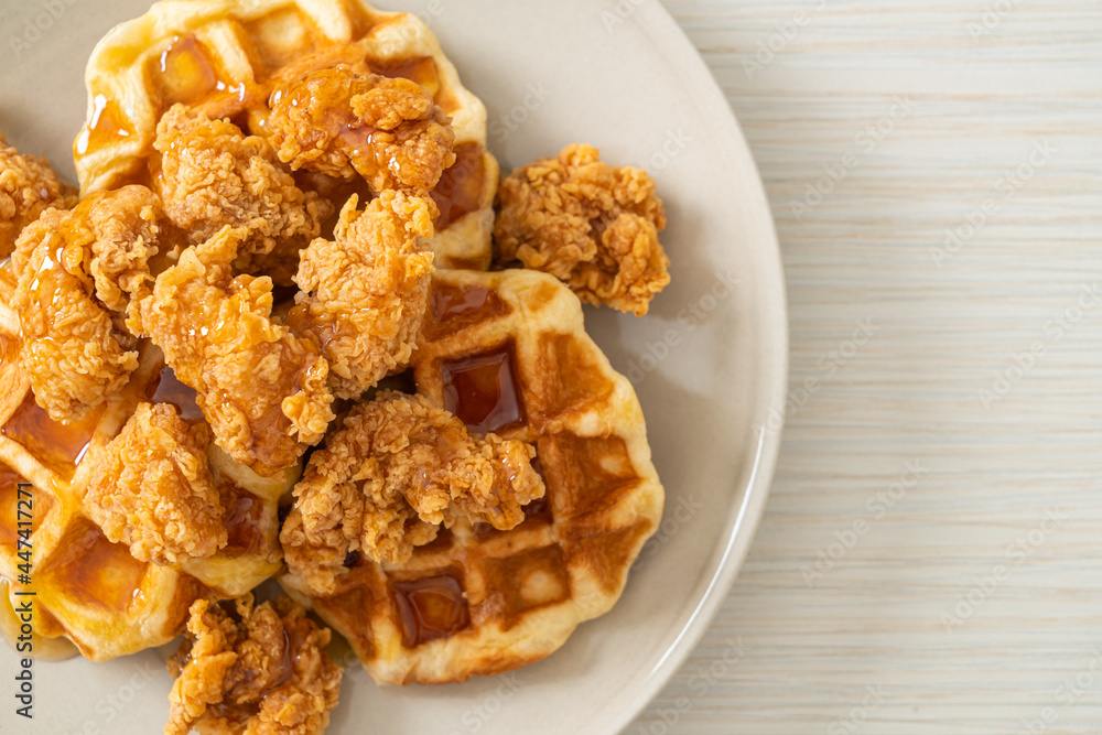 fried chicken waffle with honey or maple syrup fried chicken waffle with honey or maple syrup