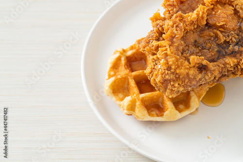 fried chicken waffle with honey or maple syrup