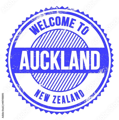 WELCOME TO AUCKLAND - NEW ZEALAND, words written on light blue stamp