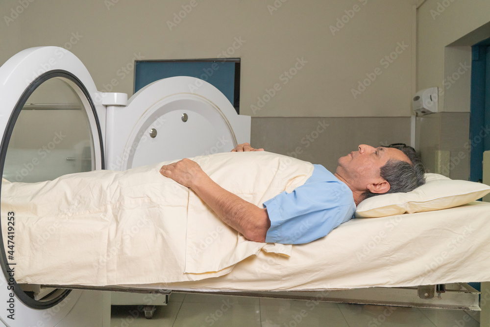 Man receiving treatment in the hyperbaric chamber Man receiving treatment in the hyperbaric chamber