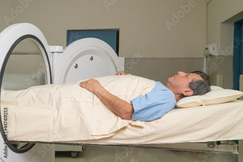 Man receiving treatment in the hyperbaric chamber