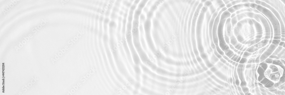 Water panoramic banner background. White water texture, aqua surface with rings and ripples