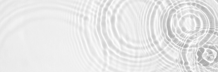 Water panoramic banner background. White water texture, aqua surface with rings and ripples