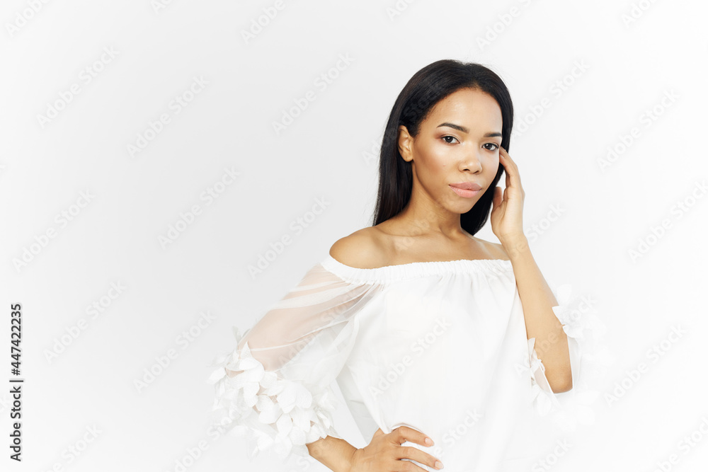 pretty woman african appearance cosmetics on face posing side glance pretty woman african appearance cosmetics on face posing side glance