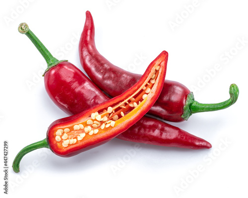 Canvas Print Fresh red chilli peppers and cross section of chilli pepper with seeds isolated on white background