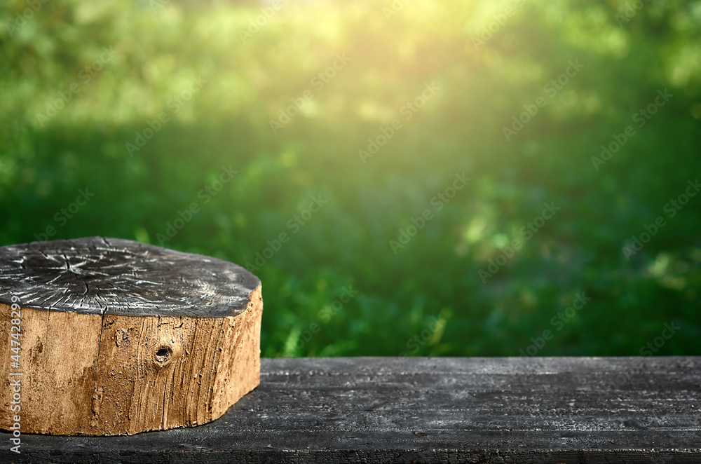 a stump burned on a black wooden table for advertising a product a stump burned on a black wooden table for advertising a product