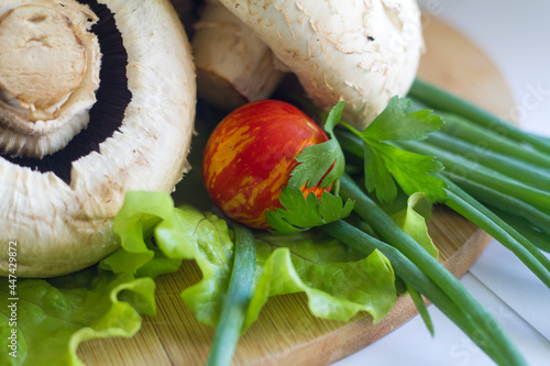 cooked champignons with tomatoes and herbs