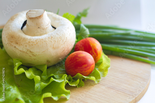 cooked champignons with tomatoes and herbs