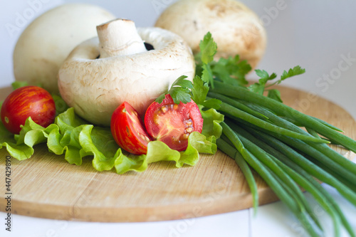 cooked champignons with tomatoes and herbs