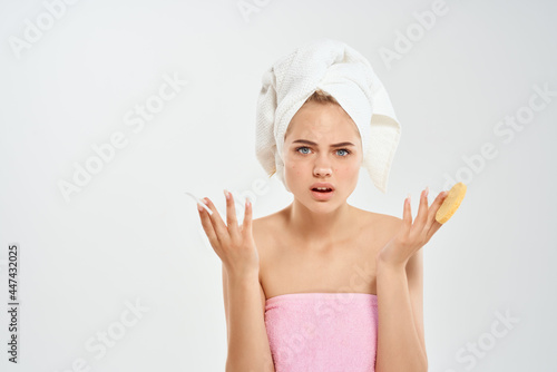 woman with a towel on her head cotton pads health hygiene close-up