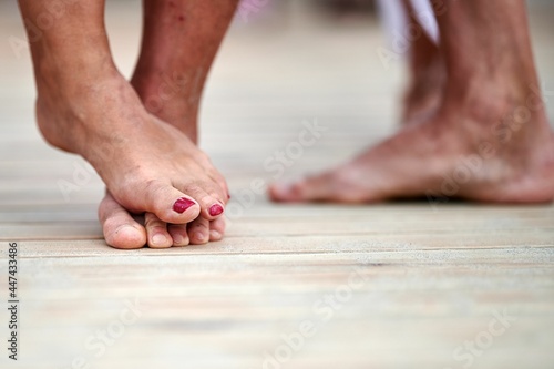 bare feet on a wooden dance floor