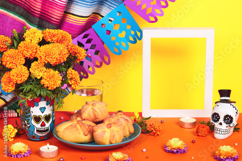 Day of the dead, Dia De Los Muertos Celebration Background With sugar Skull, calaverita, marigolds or cempasuchil flowers, bread of death or Pan de Muerto and empty frame. Traditional Mexican culture  photo