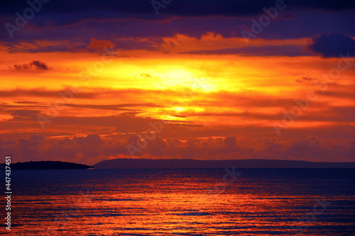 Beautiful scenic landscape with dramatic cloudy sky at sunset and a sun glade on a ripple sea water in Sihanouk ville  Gulf of Thailand  Pacific Ocean  Cambodia  South East Asia