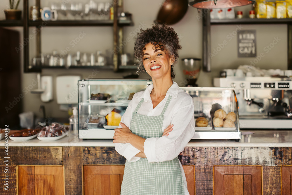 Happy mature businesswoman feeling confident in her business