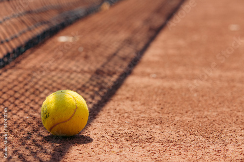 tennis ball on court © Marko
