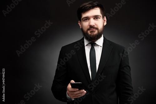 Portrait of businessman with smart phone