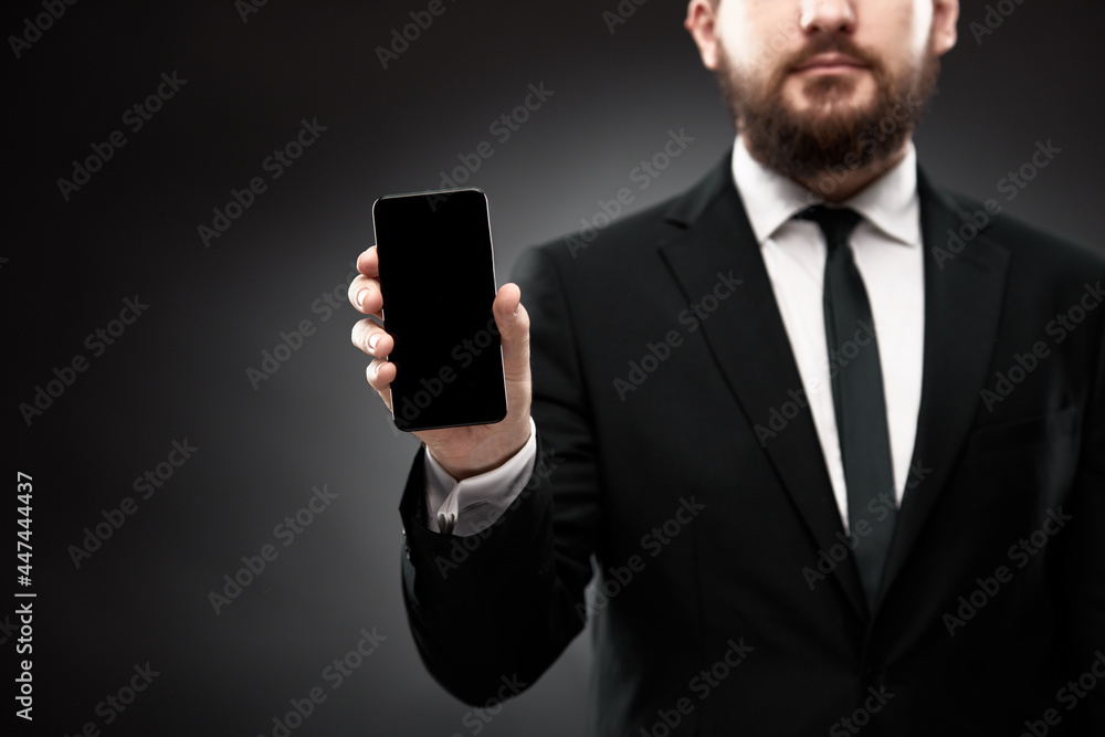 Businessman demonstrating smart phone screen