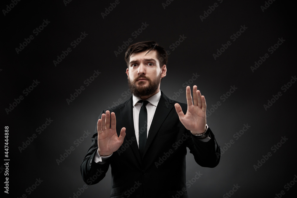 Businessman showing denying gesture with hands Businessman showing denying gesture with hands