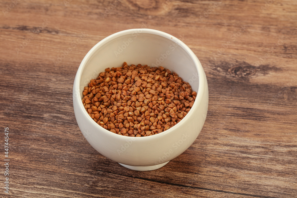 Raw buсkwheat cereal in the bowl Raw buсkwheat cereal in the bowl