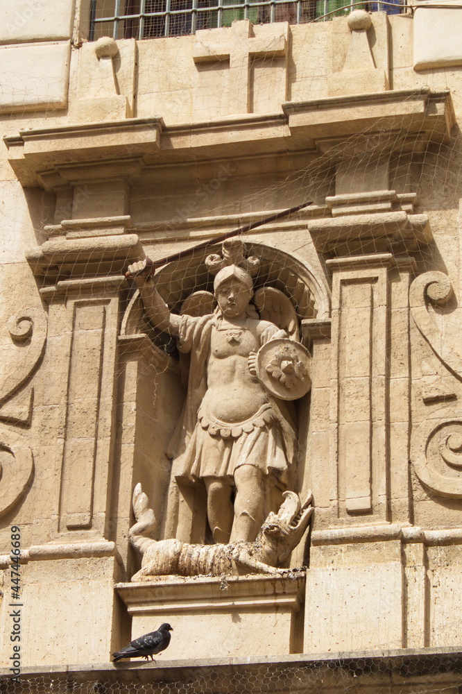 Baroque facade of the Catholic church of San Miguel in Murcia, with sculptures of saints