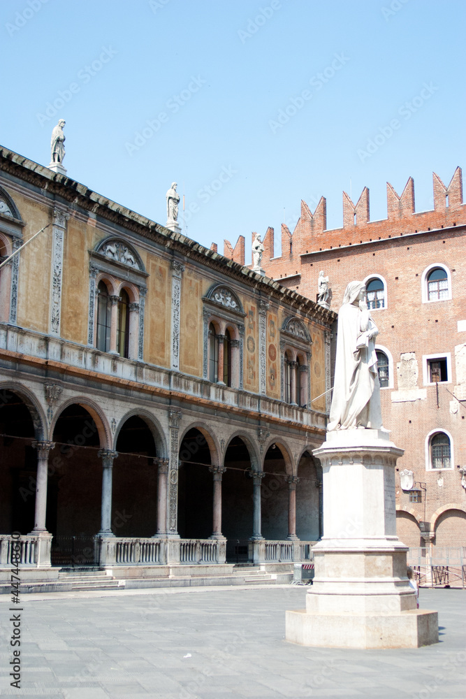 An attractive scenic Piazza in a Tuscan town in Italy with a statue of thinking man