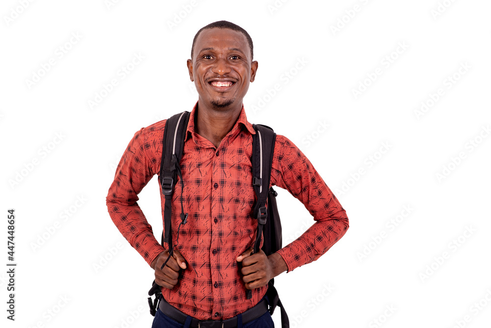 young man student carrying a backpack and smiling at camera. young man student carrying a backpack and smiling at camera.