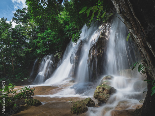 Scenic waterfall in lush rainforest. Sai Yok Noi Waterfall  Kanchanaburi  Thailand