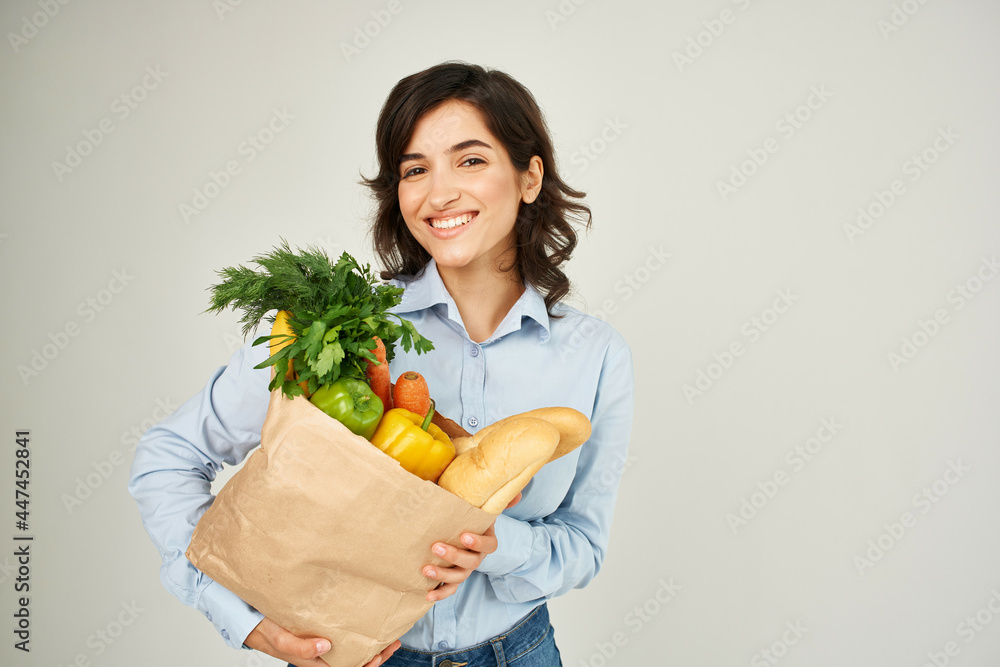 woman with paper bag of groceries supermarket lifestyle woman with paper bag of groceries supermarket lifestyle